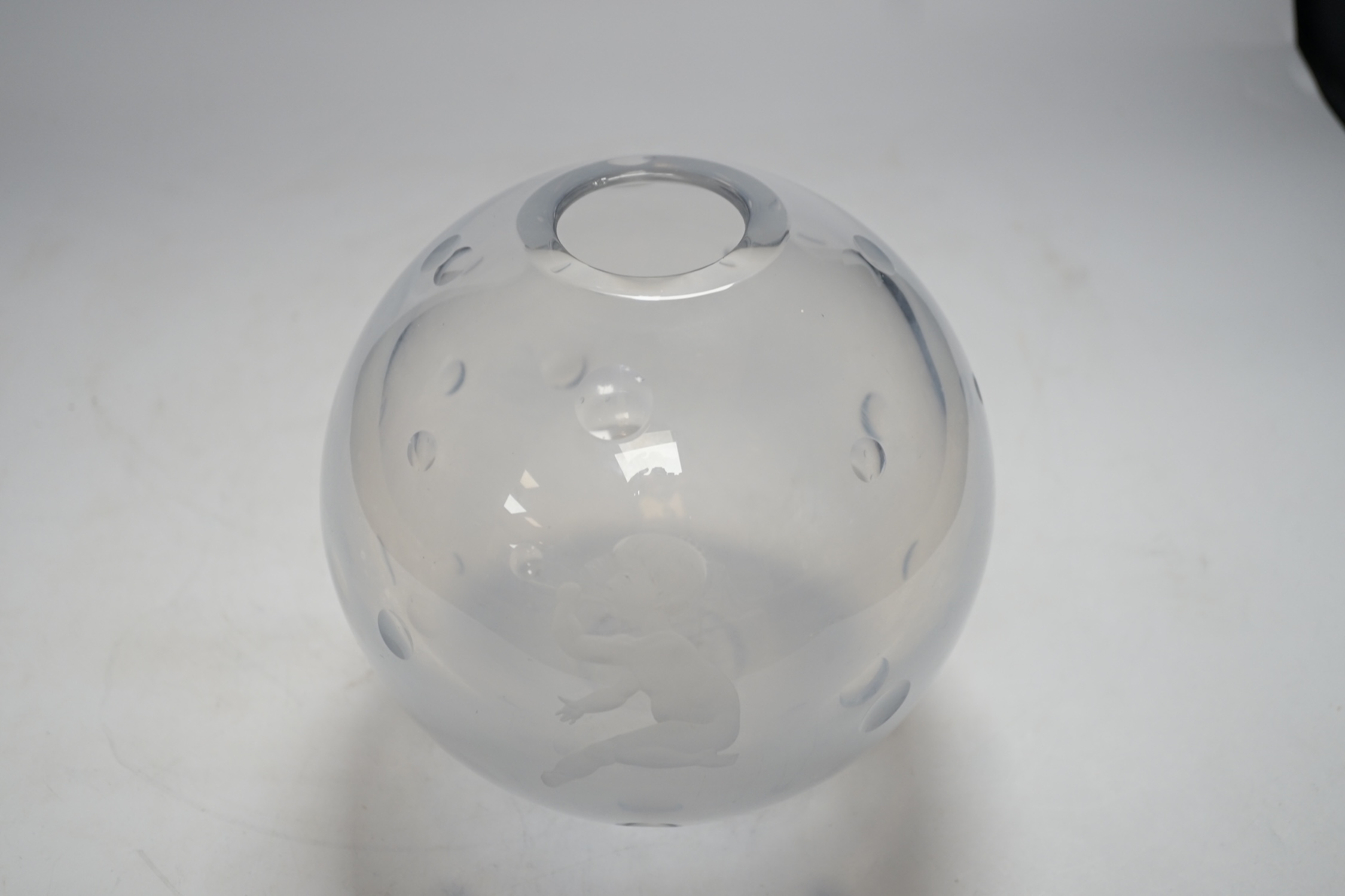 An Orrefors globular glass vase, engraved with a boy blowing bubbles, attributed to Vicke Lindstrand, indistinctly signed on worn base, 19cm high
